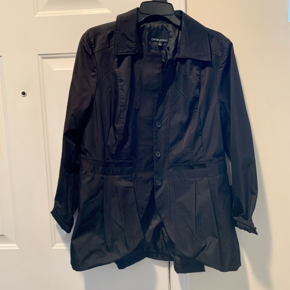 Black satin dressy jacket with buttons and pleats. Looks really trendy on.
